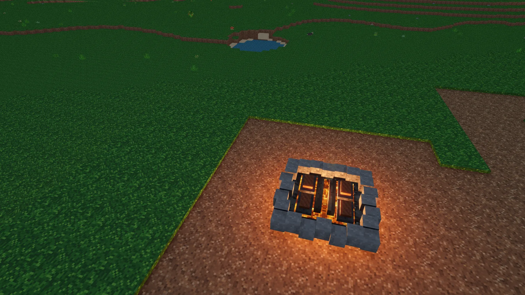 A glowing campfire in the Versalox voxel world
