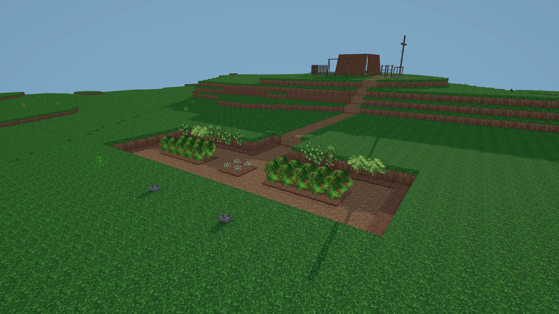 A growing Versalox settlement with fields and a camp on a hill